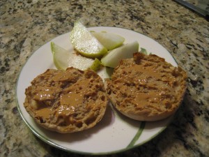 English muffin spread with all natural peanut butter.